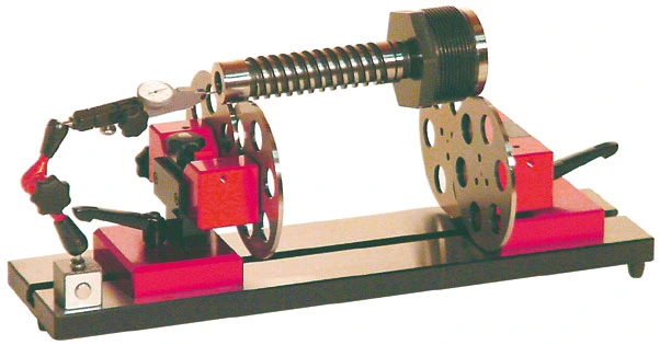 Run-out testers with roller discs